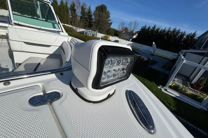 Slide: The Image of 2021 Blackfin 252 DC boat spotlight and deck detail in a residential setting. - 25