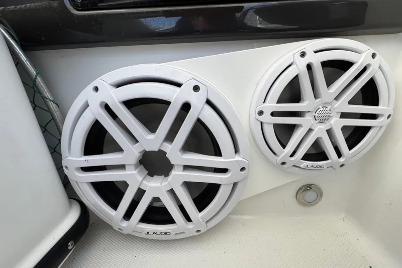 Slide: The Image of White JL Audio speakers on a 2021 Blackfin 252 DC boat interior. - 28