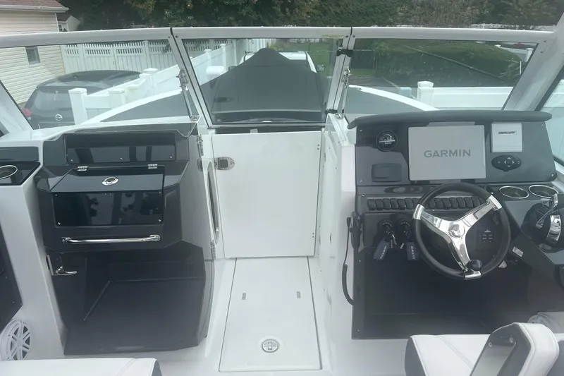 Slide: The Image of 2021 Blackfin 252 DC boat cockpit with Garmin navigation system and modern controls. - 3