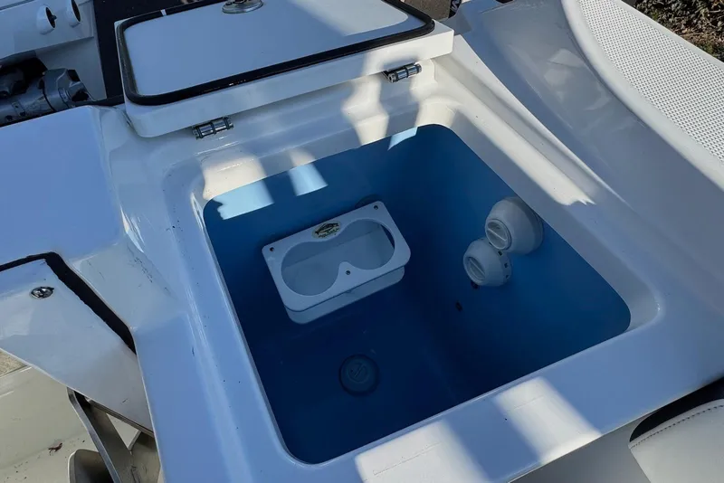 Slide: The Image of Livewell compartment on a 2021 Blackfin 252 DC boat, featuring a blue interior. - 30