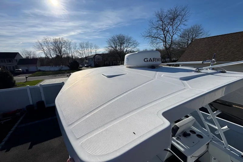 Slide: The Image of 2021 Blackfin 252 DC boat with Garmin radar, parked in a residential area. - 32