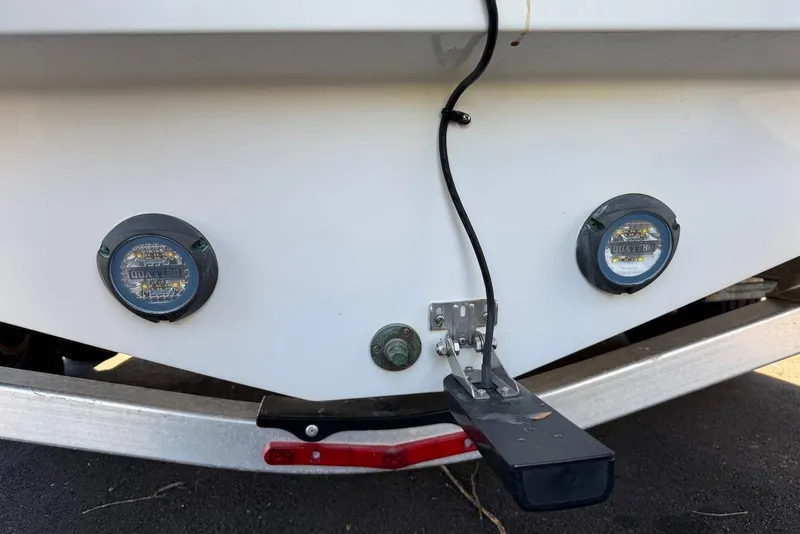 Slide: The Image of Rear view of a 2021 Blackfin 252 DC boat with underwater lights and transducer. - 39