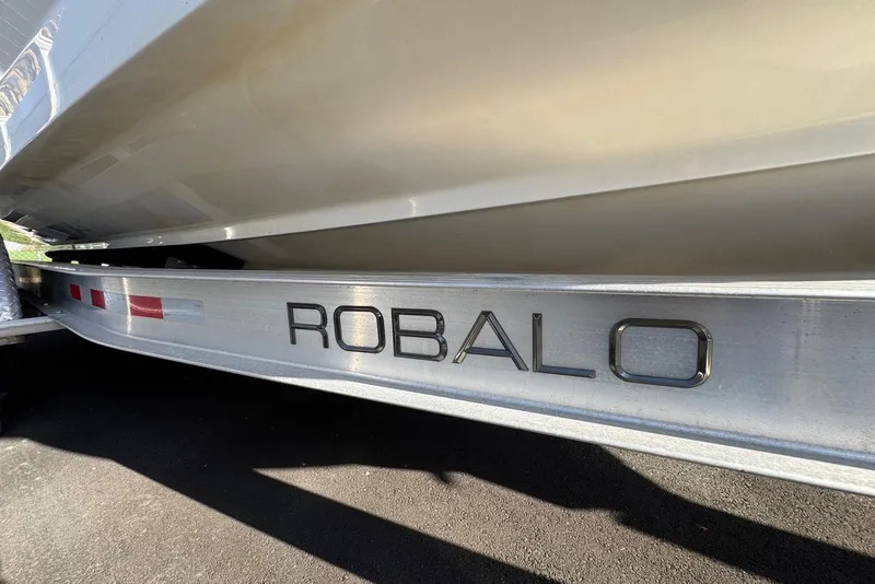 Slide: The Image of Trailer with "Robalo" branding, supporting a 2021 Blackfin 252 DC boat. - 45