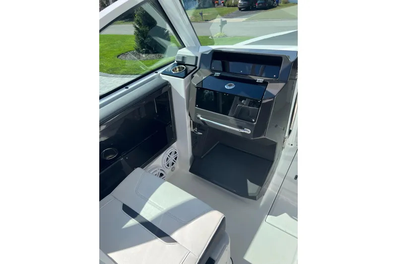 Slide: The Image of 2021 Blackfin 252 DC boat interior with modern dashboard and seating. - 5