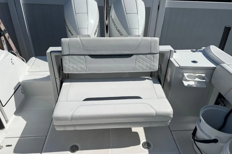 Slide: The Image of 2021 Blackfin 252 DC boat with foldable seating and dual Mercury engines. - 6