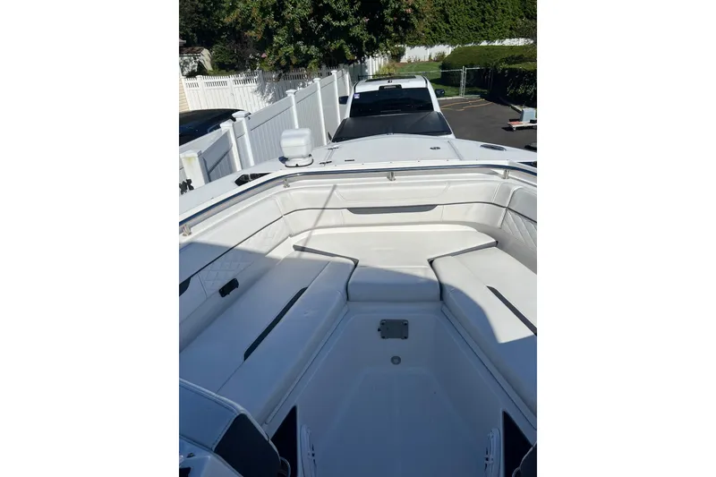 Slide: The Image of 2021 Blackfin 252 DC boat interior with white seating and sleek design. - 8
