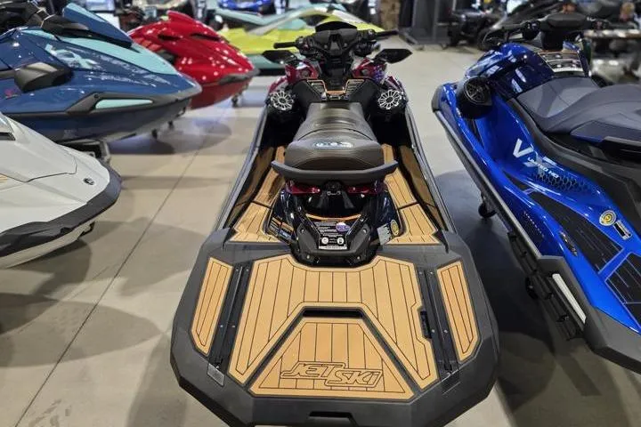 Slide: The Image of 2026 Kawasaki Jetski Ultra 310LX displayed among other watercraft in showroom. - 4