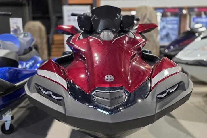 Slide: The Image of 2026 Kawasaki Jetski Ultra 310LX in showroom, sleek red design, front view. - 8