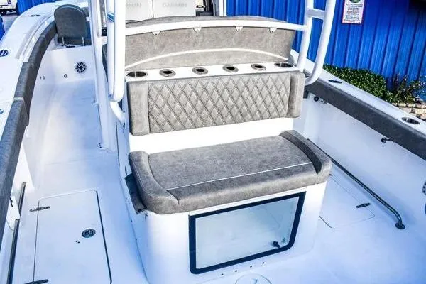 Slide: The Image of 2025 Sea Hunt Gamefish 28 Forward Seating boat interior with cushioned seating and rod holders. - 4