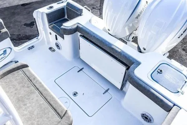 Slide: The Image of 2025 Sea Hunt Gamefish 28 Forward Seating boat interior with Yamaha engines, featuring spacious seating and storage. - 5