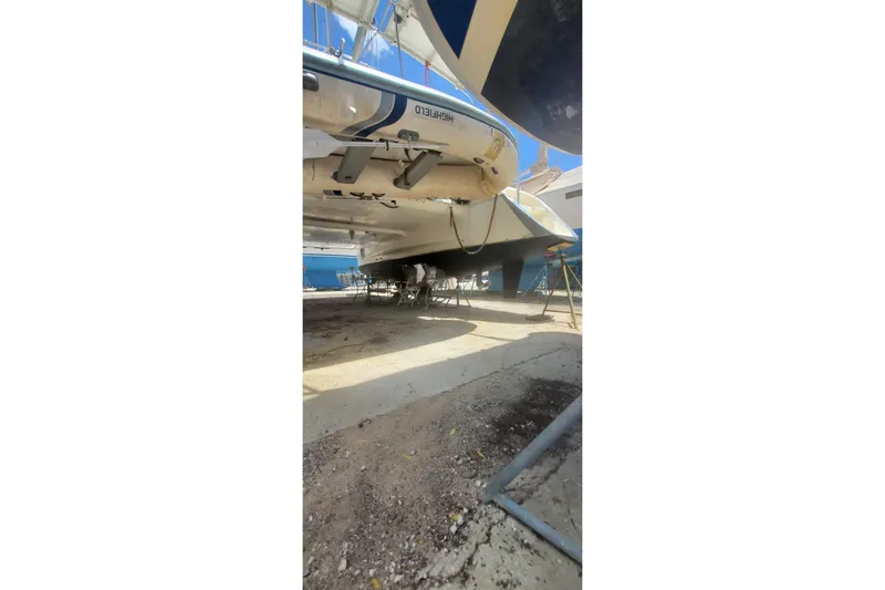 Slide: The Image of Fountaine Pajot Ninou 1992 catamaran on dry dock, underside view. - 14