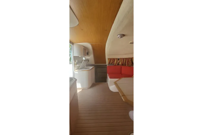 Slide: The Image of Interior of 1992 Fountaine Pajot Ninou yacht with kitchen and seating area. - 20