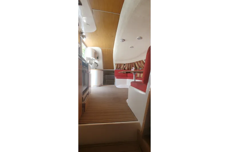 Slide: The Image of Interior of 1992 Fountaine Pajot Ninou yacht with red seating and wooden flooring. - 22