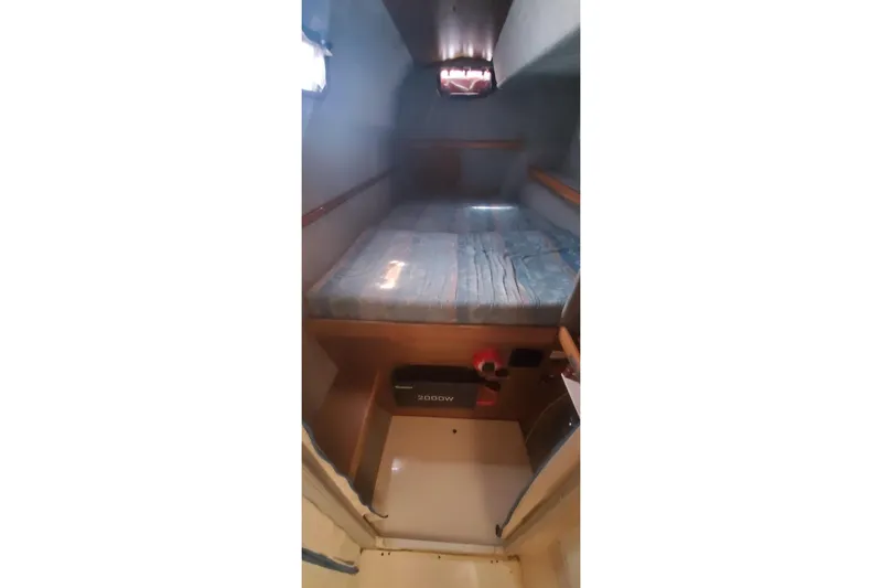 Slide: The Image of Cozy cabin interior of 1992 Fountaine Pajot Ninou with bed and storage. - 28