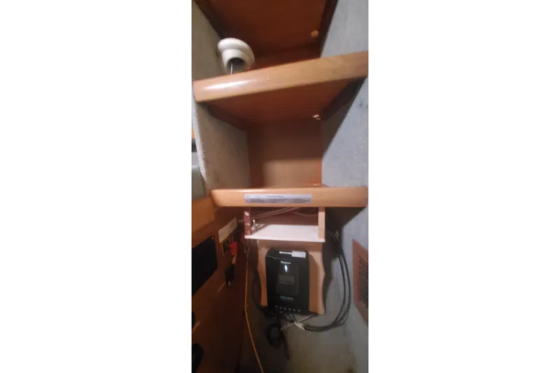 Slide: The Image of Interior shelving of 1992 Fountaine Pajot Ninou boat with electronic equipment. - 30