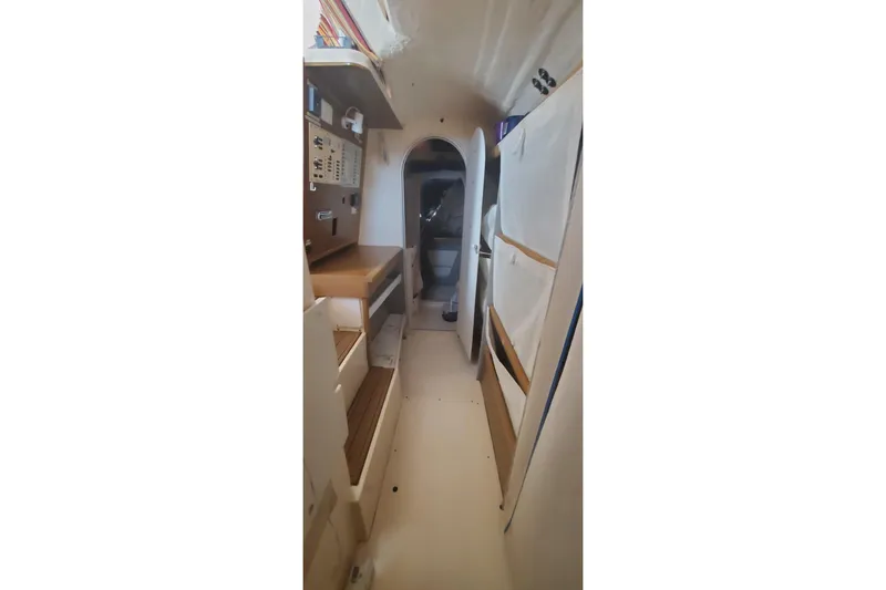 Slide: The Image of Interior of 1992 Fountaine Pajot Ninou sailboat, featuring compact cabin layout. - 32