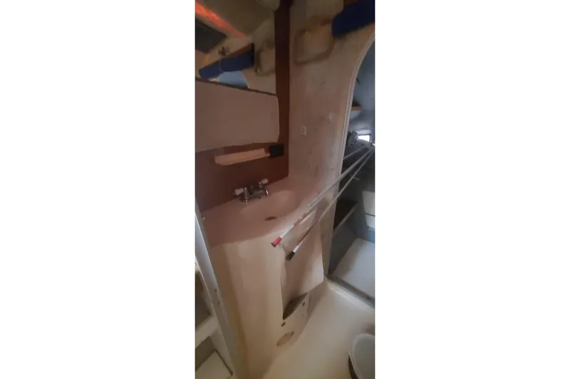 Slide: The Image of Interior of 1992 Fountaine Pajot Ninou yacht, featuring a compact bathroom sink area. - 33