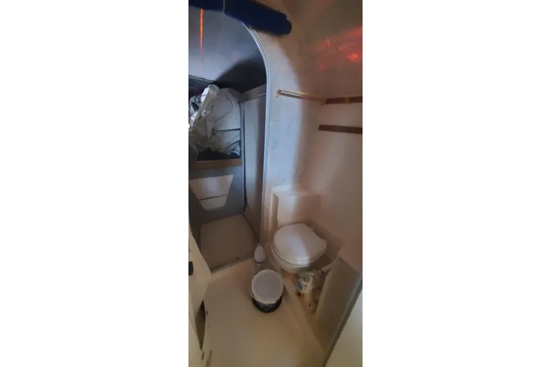 Slide: The Image of Interior of 1992 Fountaine Pajot Ninou boat bathroom with toilet and storage. - 34