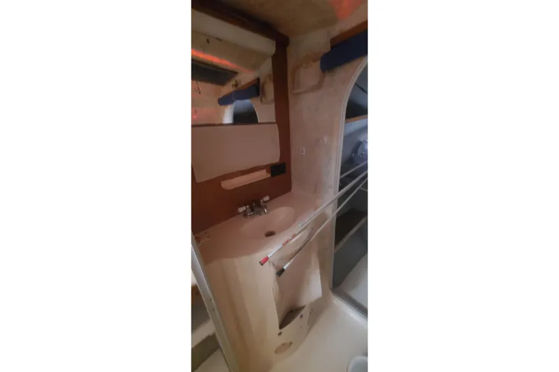 Slide: The Image of Interior of 1992 Fountaine Pajot Ninou yacht bathroom with sink and mirror. - 36