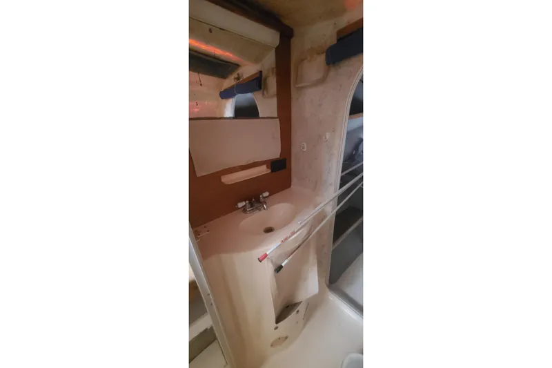 Slide: The Image of Bathroom interior of 1992 Fountaine Pajot Ninou yacht, featuring sink and mirror. - 37