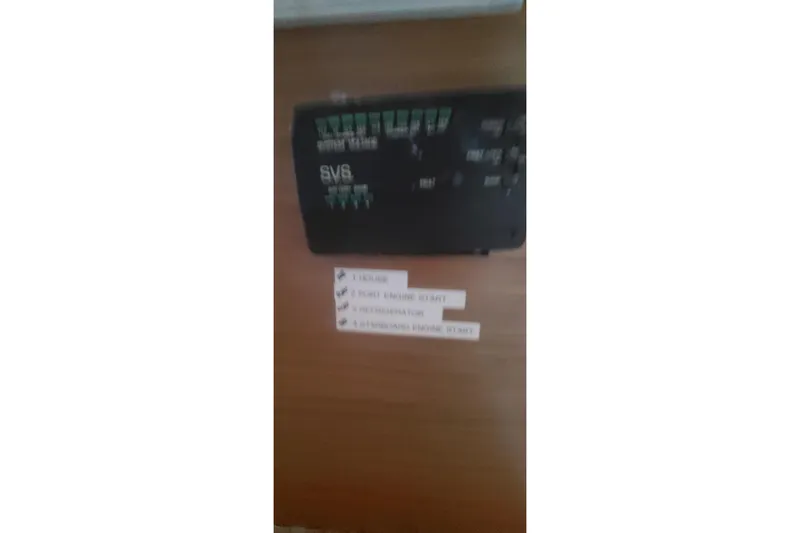 Slide: The Image of Control panel on 1992 Fountaine Pajot Ninou boat with labeled switches. - 44