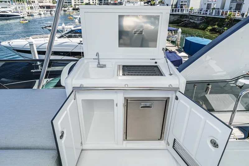 Slide: The Image of Outdoor kitchen on 2024 Azimut Fly 53 yacht with grill and sink. - 16