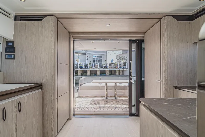 Slide: The Image of Luxurious interior of 2024 Azimut Fly 53 yacht with modern wood finishes and spacious design. - 27