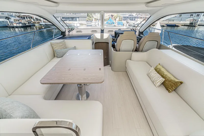 Slide: The Image of Luxurious interior of 2024 Azimut Fly 53 yacht with elegant seating and scenic marina view. - 35