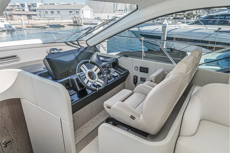 Slide: The Image of 2024 Azimut Fly 53 yacht helm with modern controls and luxurious seating. - 40