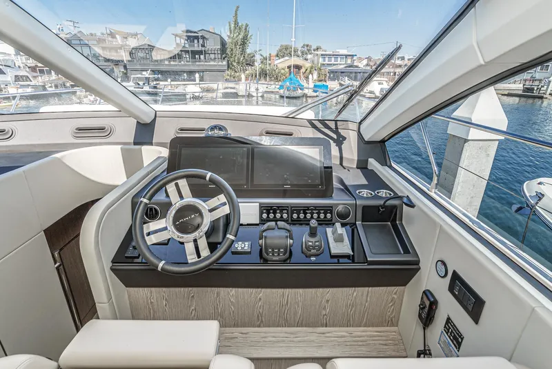 Slide: The Image of 2024 Azimut Fly 53 yacht helm with modern controls and waterfront view. - 41