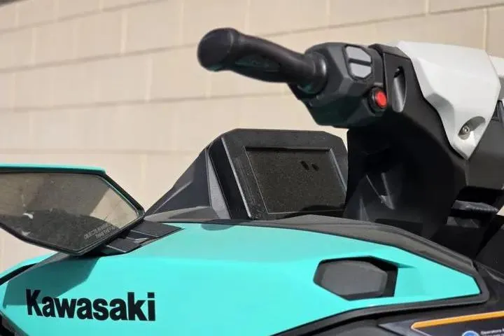 Slide: The Image of 2026 Kawasaki Jetski Ultra 310LX-S, close-up of handlebars and dashboard, teal and black design. - 11