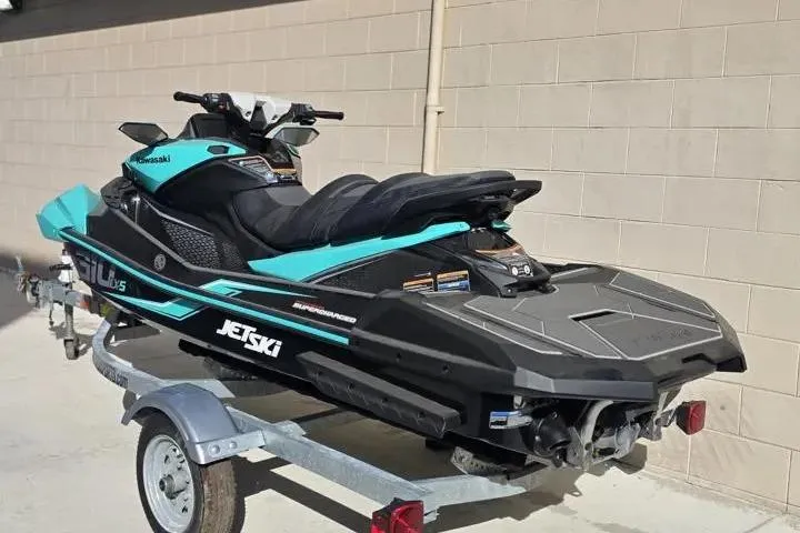 Slide: The Image of 2026 Kawasaki Jetski Ultra 310LX-S on trailer, parked outdoors. - 3