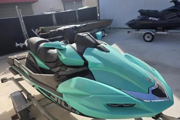 Slide: The Image of 2026 Kawasaki Jetski Ultra 310LX-S in vibrant teal on a trailer. - 7