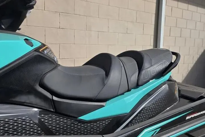 Slide: The Image of 2026 Kawasaki Jetski Ultra 310LX-S, sleek black and teal seat design. - 9