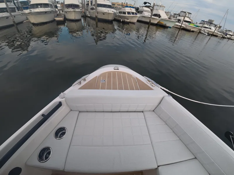 Slide: The Image of The image shows the bow of a 2027 Saxdor 340 GTWA, docked in a marina. - 23