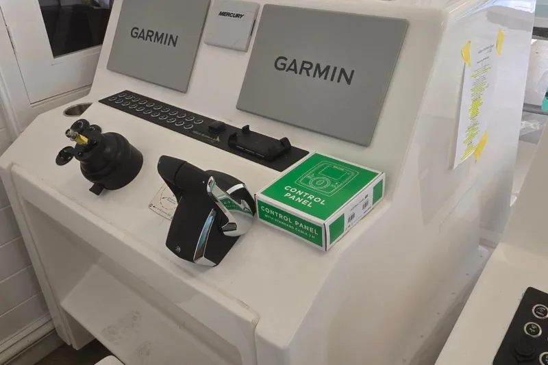 Slide: The Image of Control panel of 2026 Albury Brothers 27 boat with Garmin and Mercury equipment. - 5