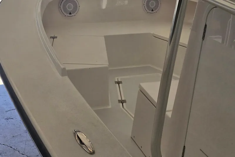 Slide: The Image of 2026 Albury Brothers 27 boat interior with seating and speakers. - 7