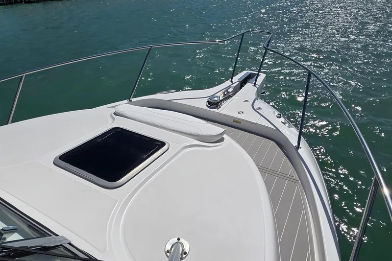 Slide: The Image of 2007 Boston Whaler 305 Conquest boat deck on sparkling water. - 14