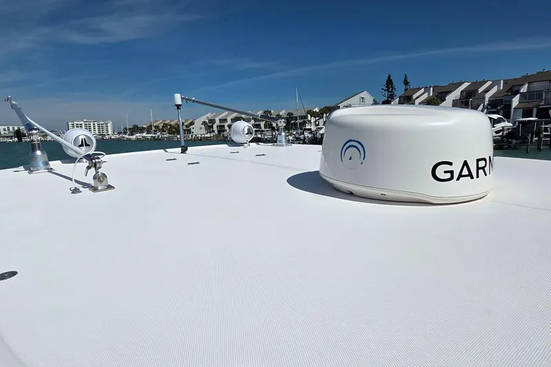 Slide: The Image of 2007 Boston Whaler 305 Conquest boat deck with Garmin radar, docked in marina. - 15