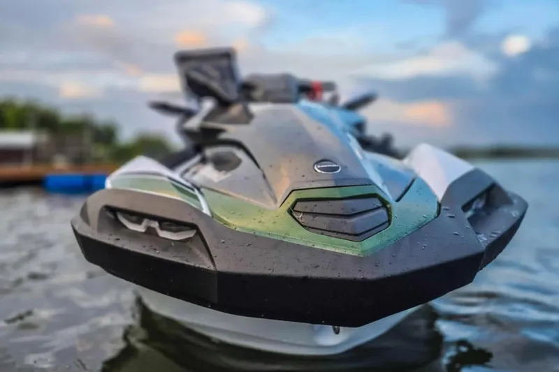 Slide: The Image of 2025 Kawasaki Ultra 160LX-S Angler jet ski on water, close-up front view. - 12