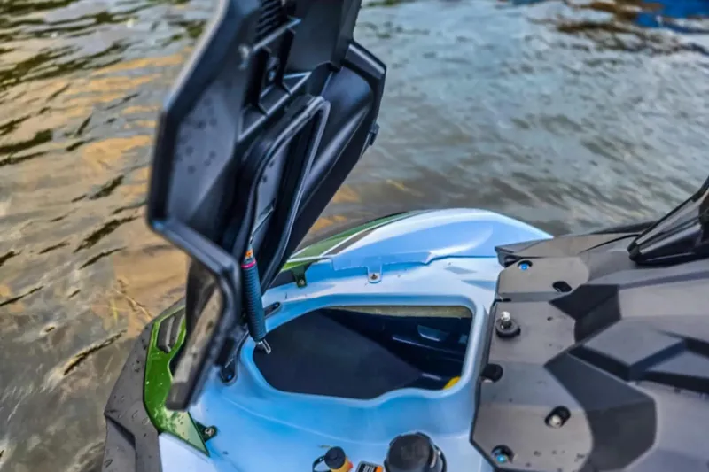 Slide: The Image of 2025 Kawasaki Ultra 160LX-S Angler with open storage compartment by the water. - 15