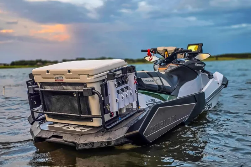 Slide: The Image of 2025 Kawasaki Ultra 160LX-S Angler jet ski on water at sunset. - 3