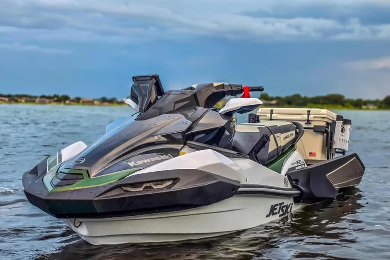 Slide: The Image of 2025 Kawasaki Ultra 160LX-S Angler jet ski on water, showcasing sleek design. - 5