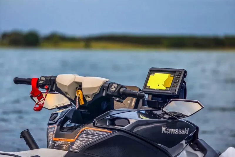 Slide: The Image of 2025 Kawasaki Ultra 160LX-S Angler jet ski with navigation system on a lake. - 9