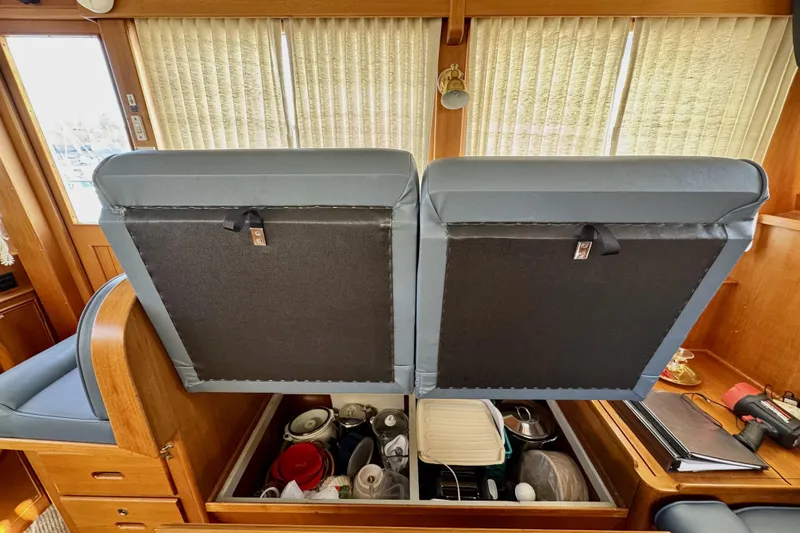Slide: The Image of Interior of 1997 Grandbanks 36 yacht with open storage under seats. - 11