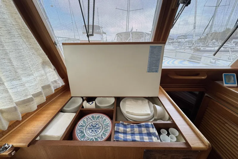 Slide: The Image of Interior of 1997 Grandbanks 36 yacht with organized dishware and nautical decor. - 16
