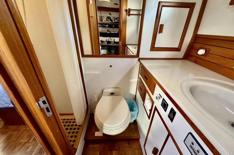 Slide: The Image of Bathroom interior of 1997 Grandbanks 36 yacht, featuring wooden cabinetry and modern fixtures. - 32