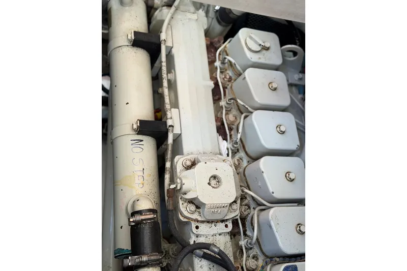 Slide: The Image of Engine components of a 1997 Grand Banks 36 Motoryacht, featuring "No Step" marking. - 50