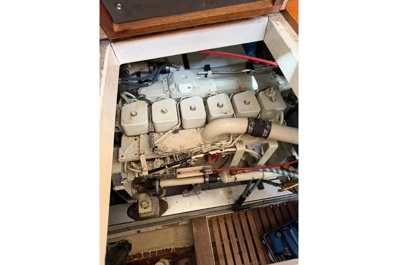 Slide: The Image of Engine compartment of a 1997 Grand Banks 36 Motoryacht, showcasing mechanical components. - 51