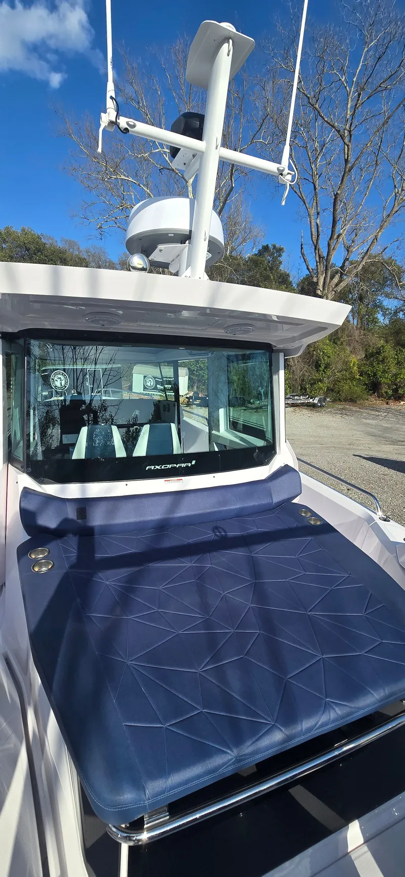 Slide: The Image of 2024 Axopar 29 boat with blue deck and radar. - 10